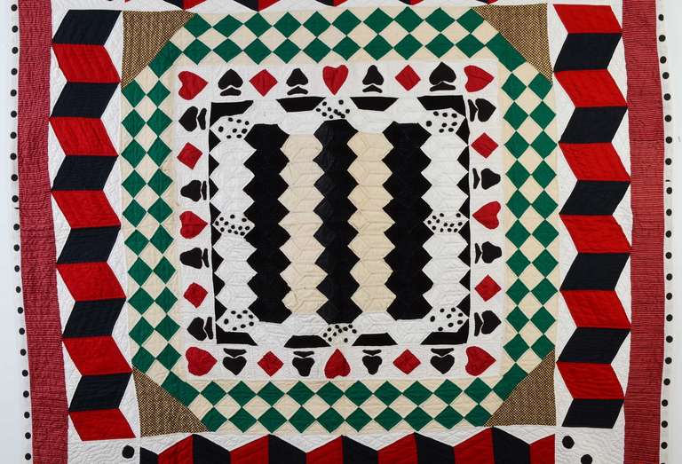 This is certainly a one of a kind quilt made  for the card playing or craps playing gambler. The green fabric is also reminiscent of the top of a pool table.
Dice are shown in the corners as well as the inner medallion. Hearts, spades, diamonds and