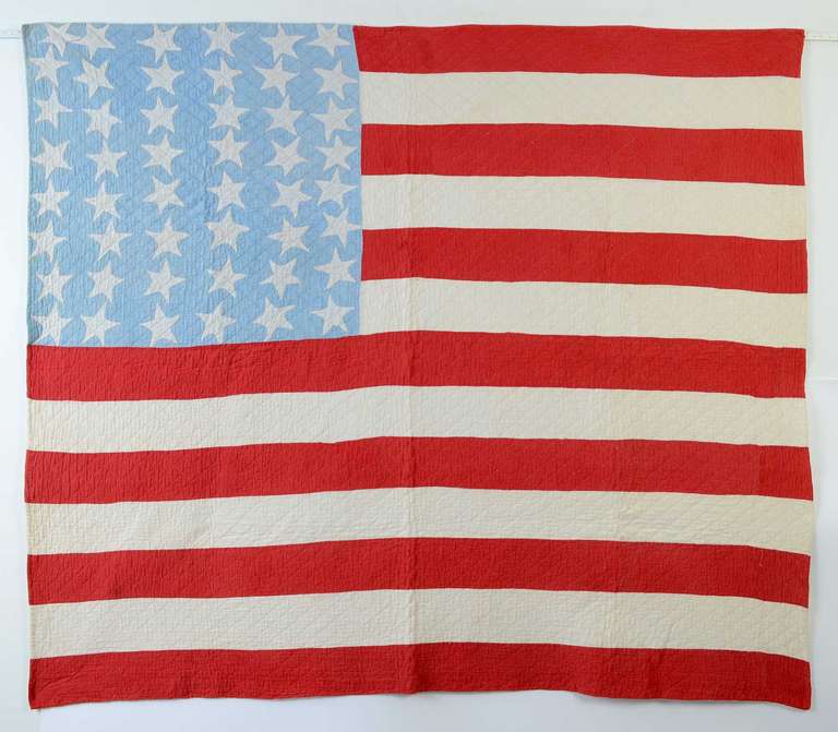 Patriotic Flag Quilts were often made to commemorate admission of a state into the Union. In 1912, both New Mexico and Arizona became states. It is likely that this 48 star quilt was made to  commemorate these significant events.
The quilt has been