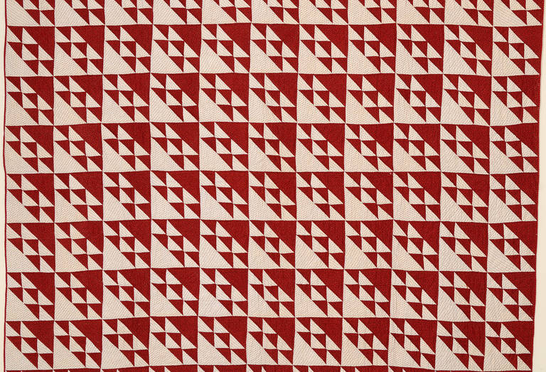 This triangles quilt pattern most closely resembles Birds in the Air but technically is a bit different. Both fabrics are tiny prints that blend well together. The backing is a complimentary small print. It is very well pieced and in excellent,