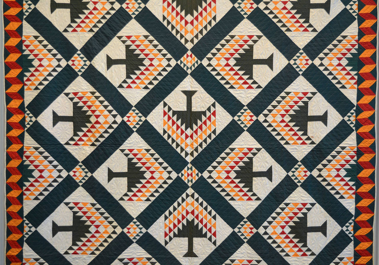 This pine tree quilt (aka Tree of Paradise) is truly a masterpiece of its type. It is brilliantly designed as well as very finely pieced and quilted. The tiny, even stitches in white thread on the green sashing at first glance look as though they
