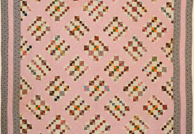 It is fascinating how a quarter turn can make a regular pattern into such an unusual one. Turning the squares on point gives an entirely new life to this four-patch in diamond quilt. Rather than just setting the four patches on point as most makers