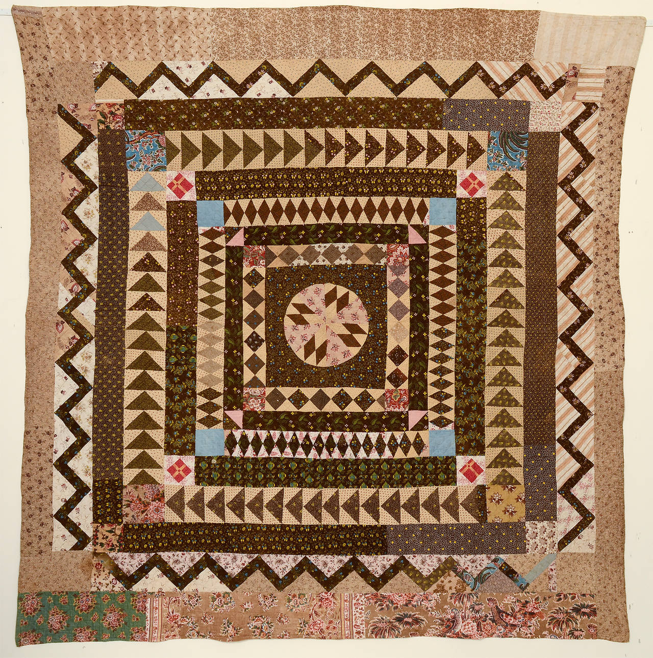 This early center medallion quilt has similarities to its English counterparts but was virtually certainly made in this country. It is interesting that the binding was done by two methods. Part of it is the European knife edge technique and the