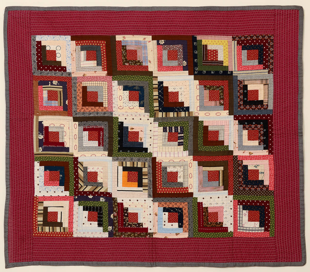 Rarely does one see a crib quilt as a scaled down version of a straight furrows log cabin. This fine example is in pristine, un-used condition. The back is a bars pattern often seen in the quilts of Southeast Pennsylvania. Measurements are 40 1/2
