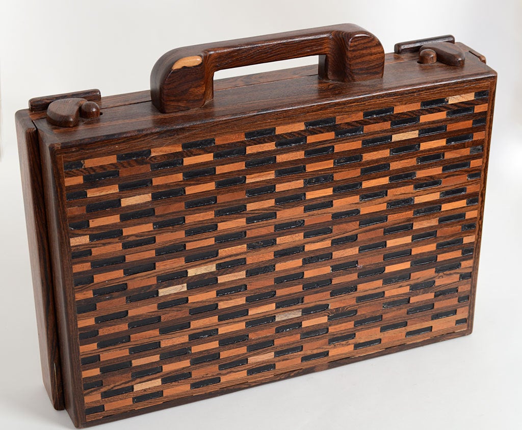 This is a wonderfully detailed and sculptural briefcase by mid 20th century designer, Don Shoemaker. Shoemaker was an American who worked in Morelia, Mexico from the 1940's until his death in 1990. His fine wood furniture and table objects have