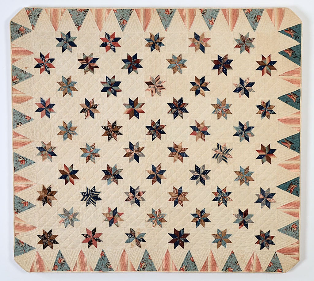 This is a gem of a crib quilt in terms of pattern; fabrics and scale. The small stars are made with a wonderful variety of early 19th century fabrics and two materials consistently used for the border. Professionally mounted on a stretcher thats