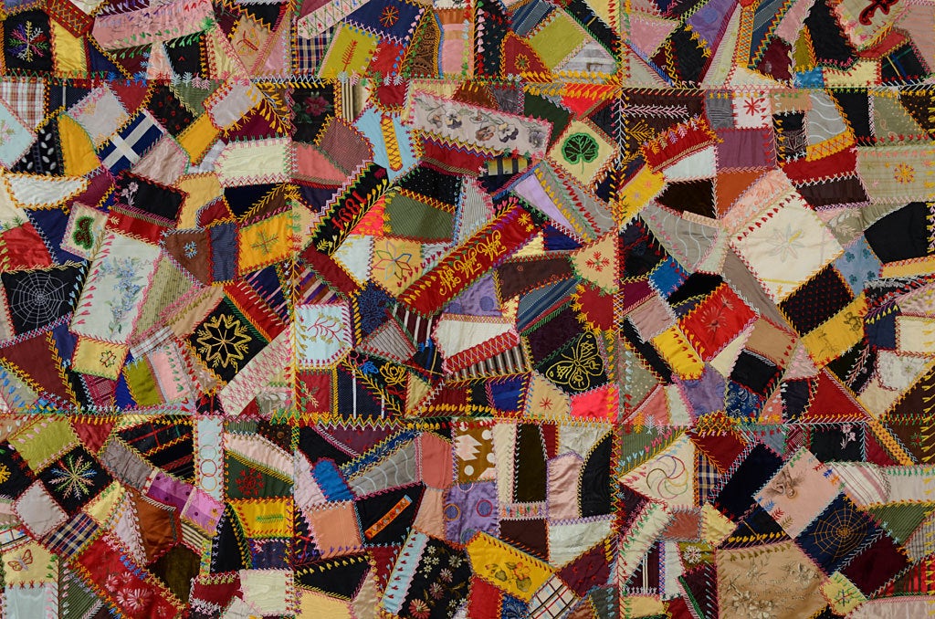 This lively Crazy Quilt has all the bells and whistles one expects in fancy quilts of this era. Embroidered motifs include butterflies; flowers; a spiderweb and fans. The written sentiments,legible in thumbnail photos, are quintessentially Victorian