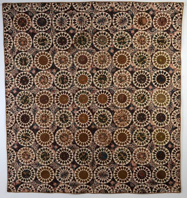 The glazed chintzes of this Sunflower Quilt make for an outstanding, elegant quilt. It is made of a variety of early printed fabrics, all in excellent condition. In addition to the background, many of the other fabrics are also glazed chintz, all