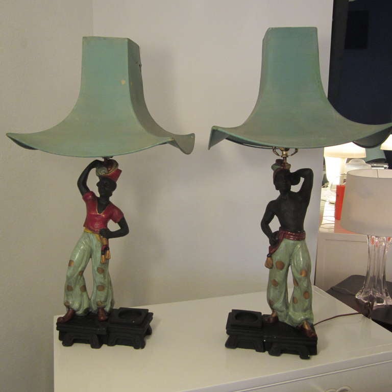 Fabulous pair of chalk-plaster Aladdin lamps complete with original shades; frames to be used to replicate shape. Ware consistent with age and use and still have the original silk wiring. The shades also are original from the 1950s and they are for