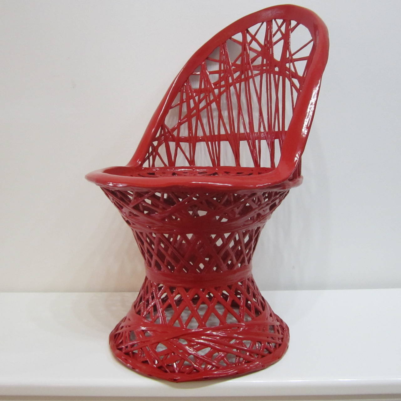 Small spun aluminum chair lacquered in rich fire engine red.