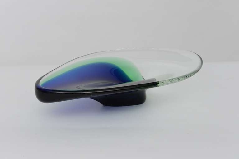 Hand blown oblong glass dish with clear glass offset by the blue/ green cased glass. Lovely shape and colors.
