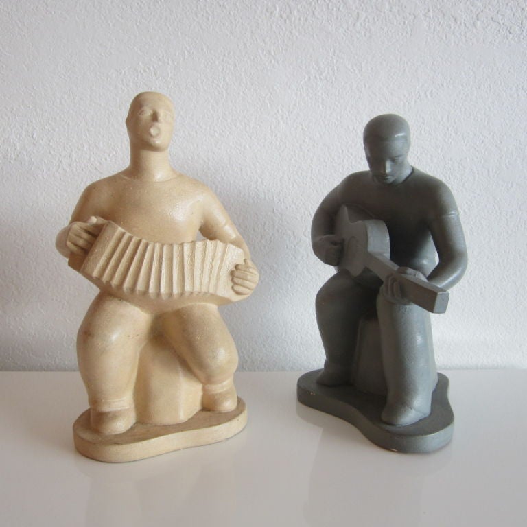 Two ceramic sculptures of musicians. Excellent pose and detail of expressions. Signature on backside of each sculpture.
