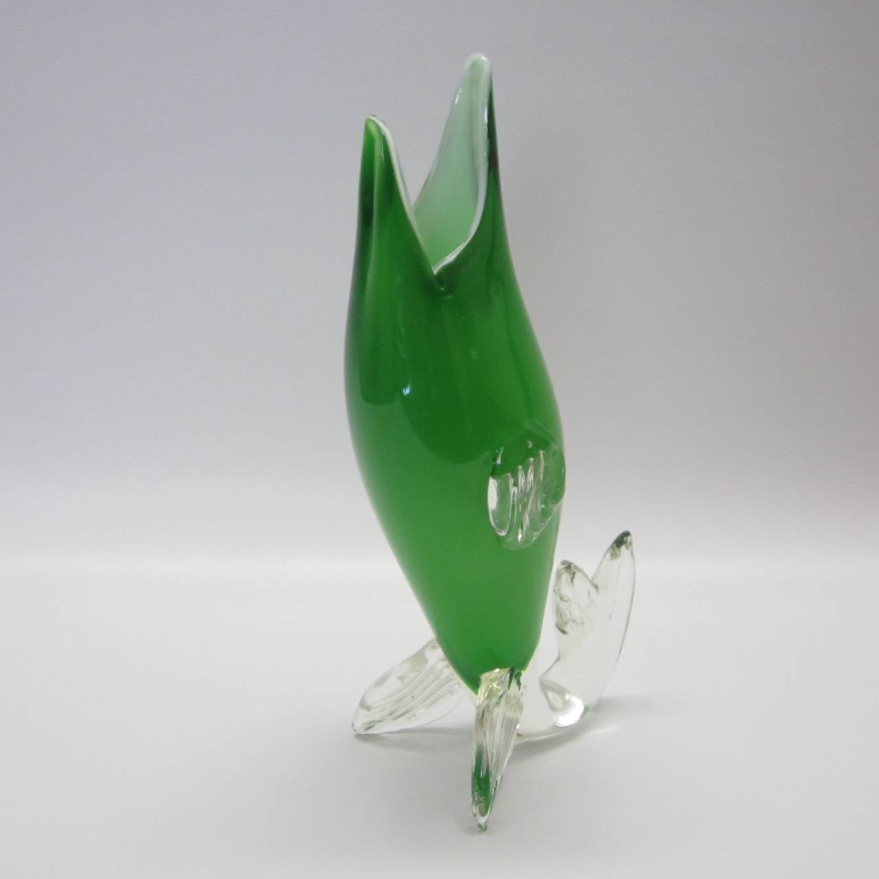 Gorgeous green Murano glass fish vase resting on clear fins. Can be displayed laying down as well.
