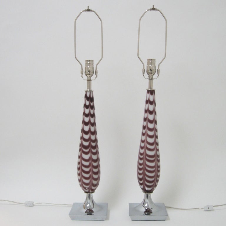 Pair of cased glass lamps in purple and white on nickeled bases and newly rewired with nickeled fittings.