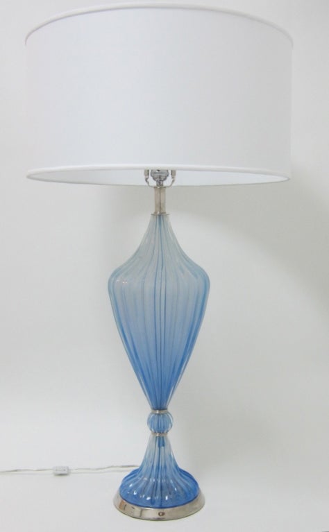 Beautiful and rare color handblown Murano glass tabletop lamp in a soothing shade of azure blue. Ribbed glass and a cinched waistline, this lamp is fully appointed in polished nickel and has been rewired with three-way top-quality socket. 