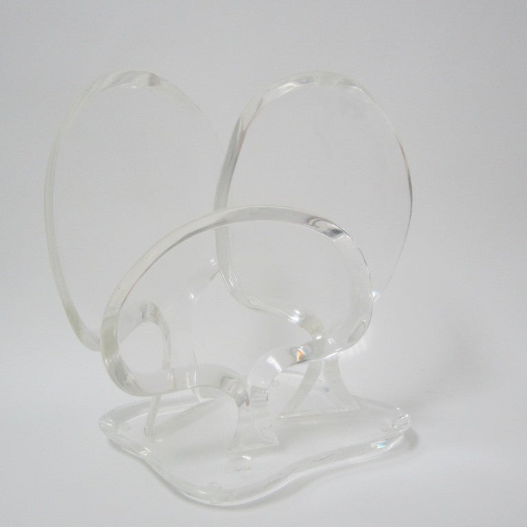 Thick lucite sculpture fashioned with three varying sized trees mounted on thick beveled and gently scalloped base. Scripted signature on base.