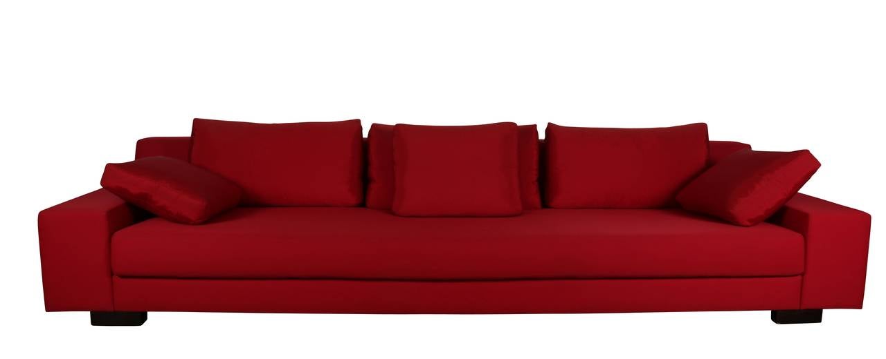 Made by Atelier Christian Liaigre in Paris, this sofa is from the earliest sold in 2001 in Paris only. Single owner was required to submit request to Mr. Liaigre to have the standard tobacco colored upholstery changed to red, which was granted but