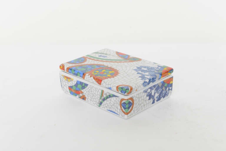 Ceramic lidded box originally designed by Antoni Gaudi in the early 20th century with faux crackle finish and colorful abstract design. 
This version was made in limited edition in the mid 20th century in Mr Gaudi's honor.