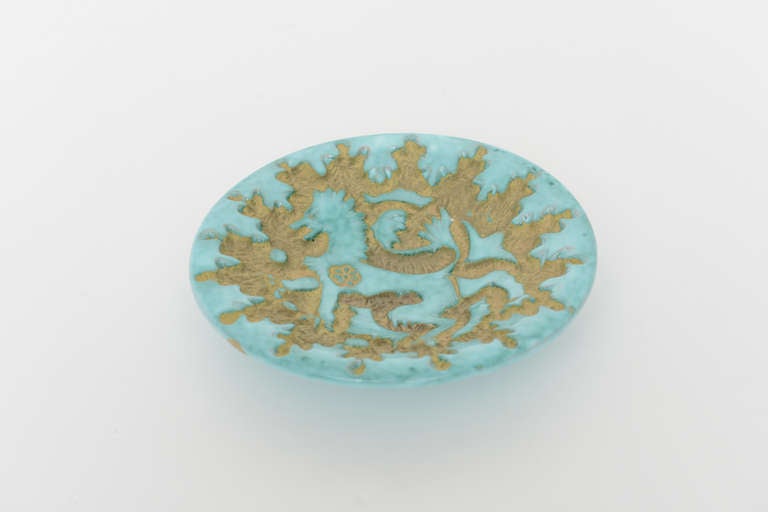 Lovely Italian aqua glazed ceramic dish with griffin design.
