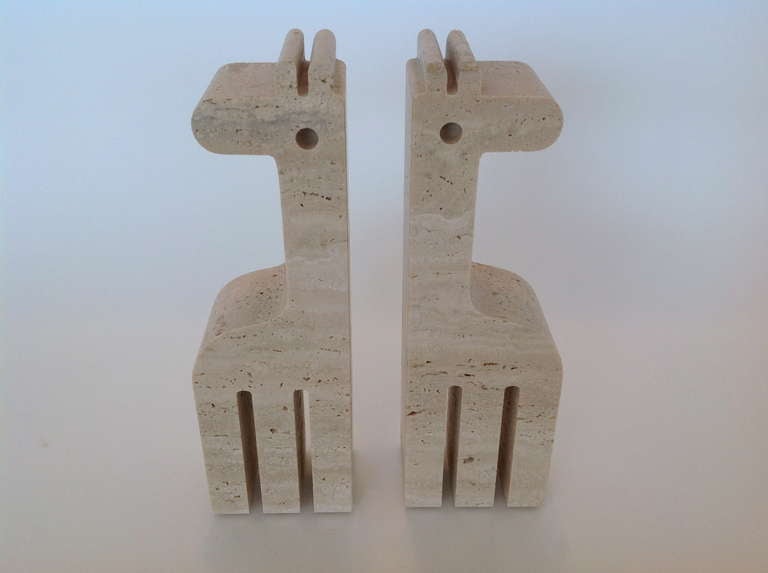 Lovely pair of abstract carved travertine bookends suitable for just about anywhere.