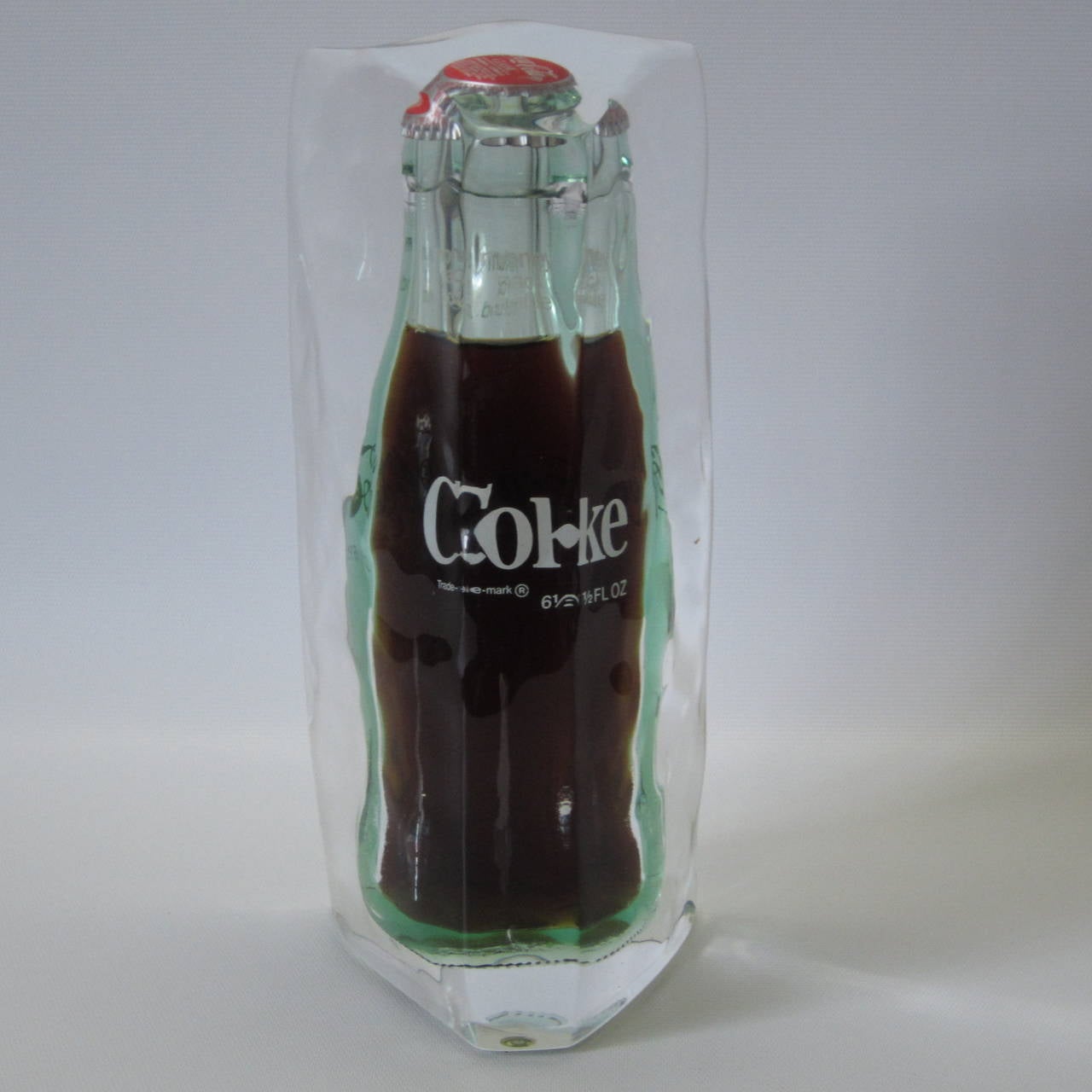 Pop-Art sculpture of unopened original bottle of Coca-Cola encased in molten Lucite. Exciting and fun and visible from all sides!