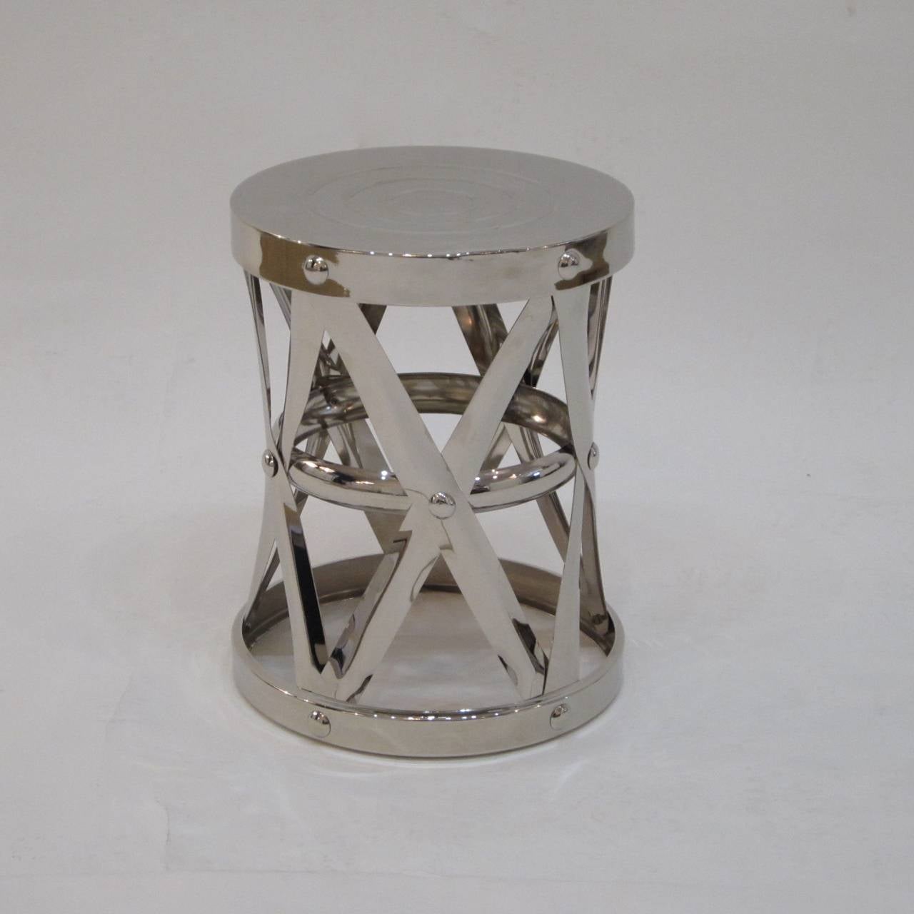 Nickel over brass garden stool or side table with circular design on top surface.