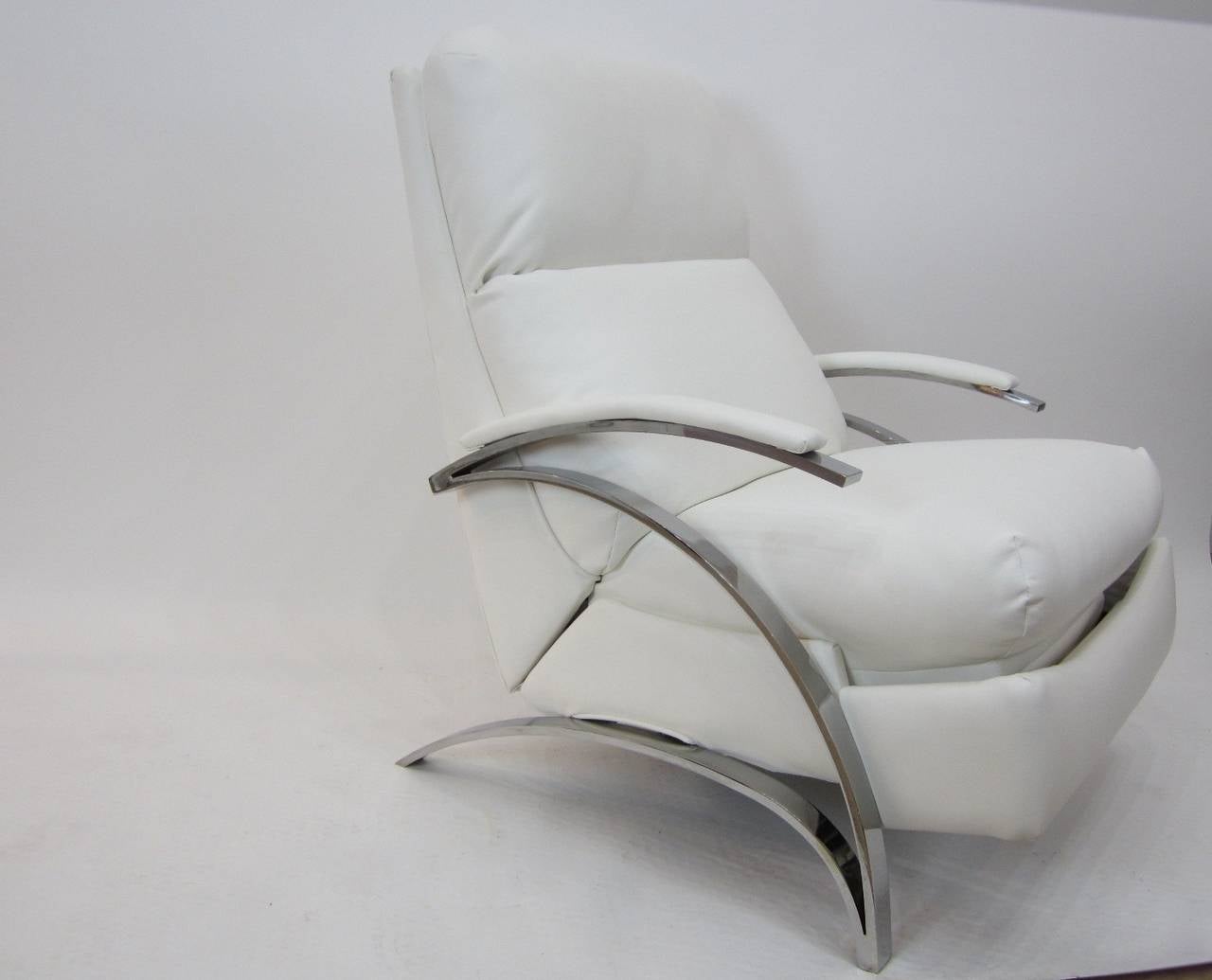 Wonderful reclining lounge chair with sculptural polished steel frame and white faux leather upholstery. The flat steel frame is solid, thick, and heavy and has been polished and shows a little natural wear--no pitting. The upholstery is newly done