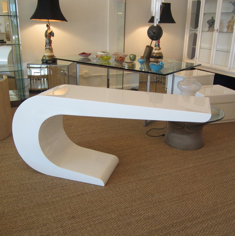 Fantastic cantilevered console table finished in high gloss white lacquer.