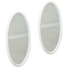 Pair of Lacquered Oval Mirrors