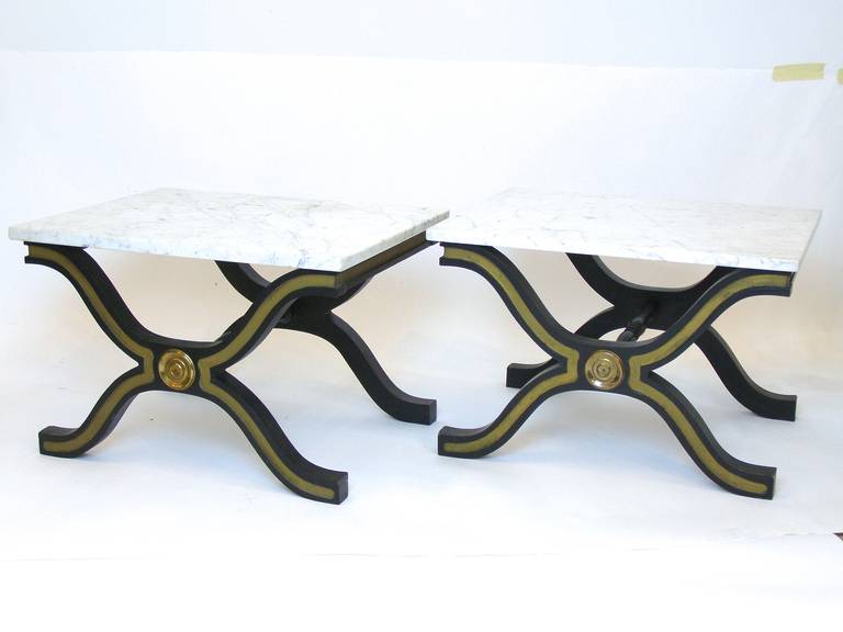 Pair of Dorothy Draper Espana side tables in original mat black with gold trim and white Carrara marble tops.