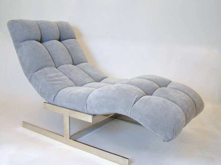 Extremely comfortable chaise longue by Milo Baughman, newly upholstered in soft gray fabric with deep tufting making this a seat to relax in, unwind and day dream away.
Newly nickeled base compliments the steel grey fabric.