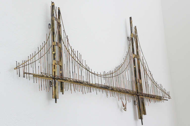 Handmade of mixed metals, this sculpture is of the Golden Gate Bridge in San Francisco, CA. Excellent execution with many scorched, welded and burnished rods with a lot of detail including the sailboats. Signed by C. Jere and impressive when mounted.
