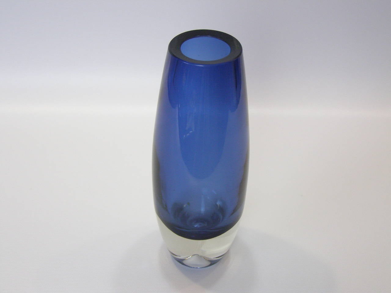 Beautiful Sommerso glass vase in smooth blue with sliced top and inscribed signature on underside.
