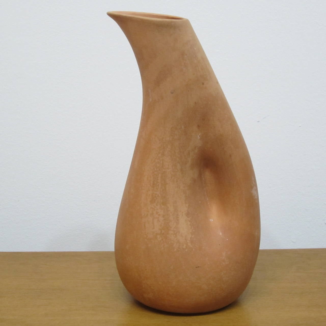 Rare terra cotta pitcher designed by Elsa Peretti for Tiffany & Co. 
Contrast interior glazing with flat finished exterior. Made in Italy marked and signed on bottom.
See our Elsa Peretti matching terra cotta bowl on our site.