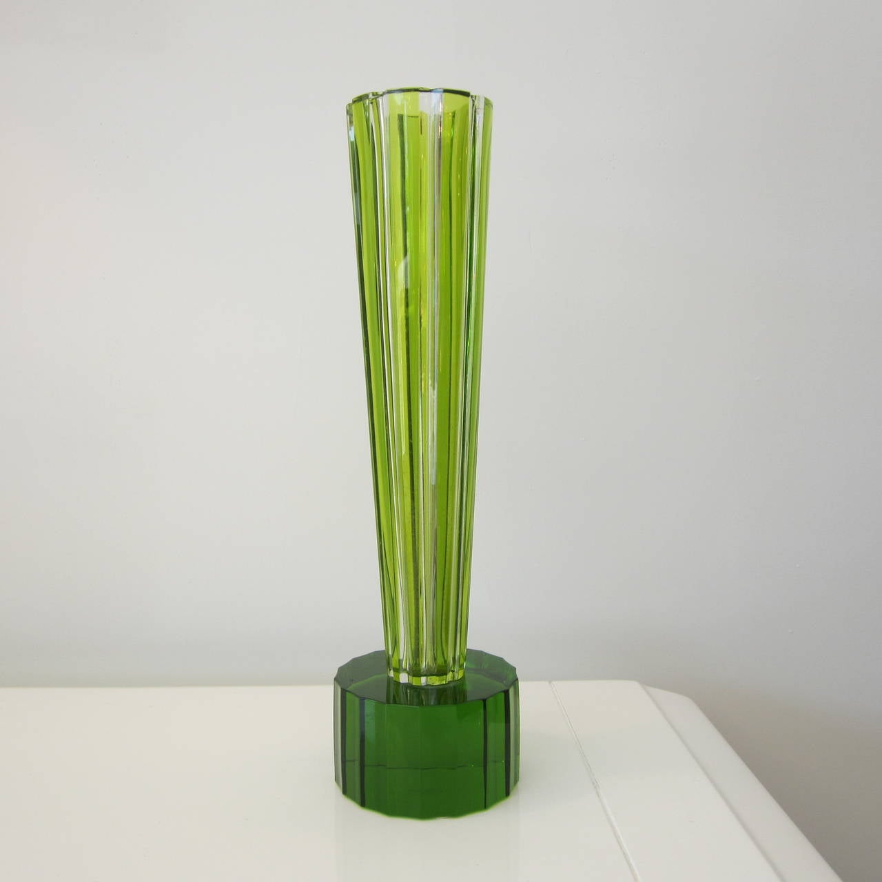From the Rencontre Collection, this is the stunning Enki Olivine trumpet form cut crystal vase with faceted columnar base numbered 9 of 49 signed by Baccarat and Ettore Sottsass.