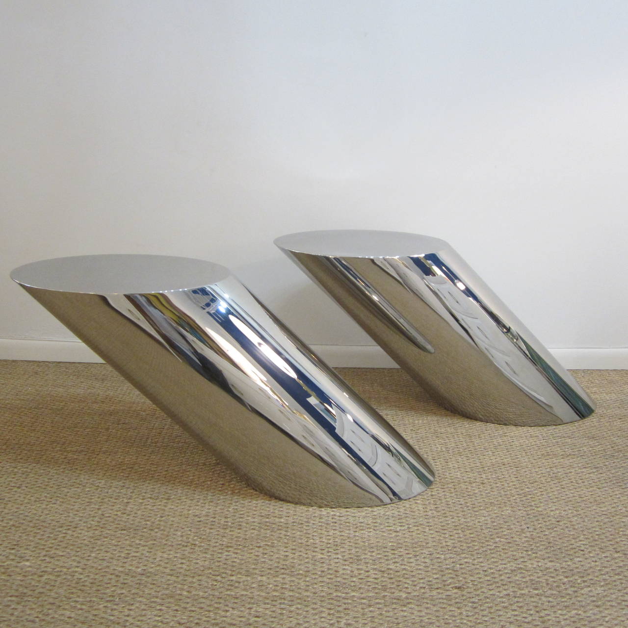 Fantastic polished stainless steel tables with counter balance weighted bottoms providing the cantilevered design. They show minimal signs of ware notably on the tops but in no way compromises their beauty and structural soundness.
Can be sold