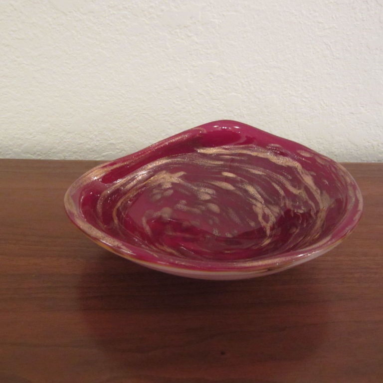 Red/Burgundy folded glass dish with copper leaf swirls.