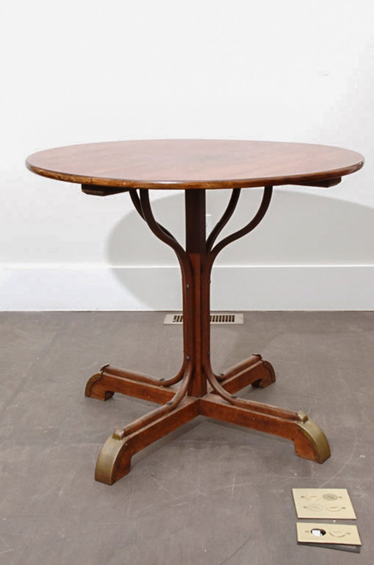 Vintage Thonet Table base with brass detailing on the feet. Contemporary round wooden top.