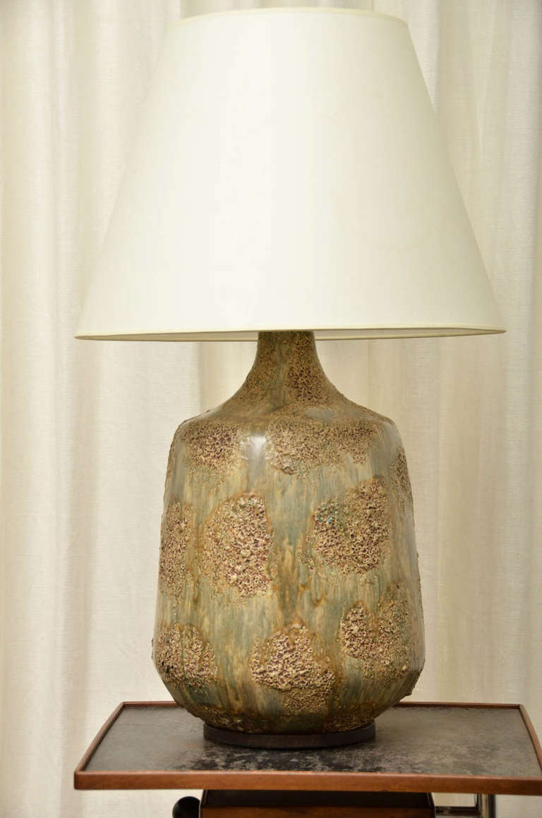 Ceramic lamp with brown and green glaze, spotted with textural areas. Teak base newly rewired for US with twisted silk cord and new fittings. Shade is not included.