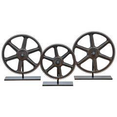 Collection of Soild Bronze Gears on Metal Display Stands