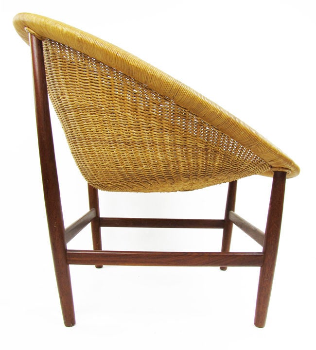 Important and early Basket Chair designed by Nanna Ditzel.  A favorite of Edward Wormley and a superb blending of Danish modern design and traditional Scandinavian craft.  Manufactured by Ludwig Pontoppidan of solid teak and hand woven