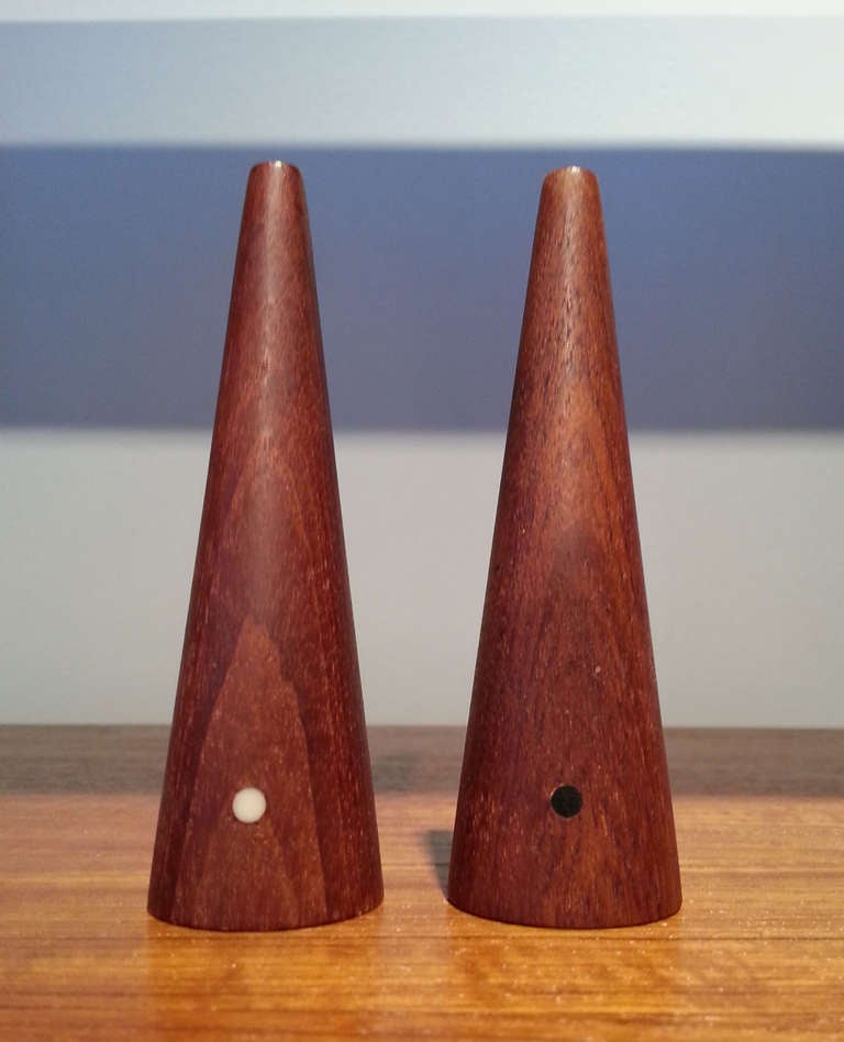 Minimalist conical pair of vintage Danish salt + pepper shakers with black & white dots to signify contents.  Solid teak, original finish.
