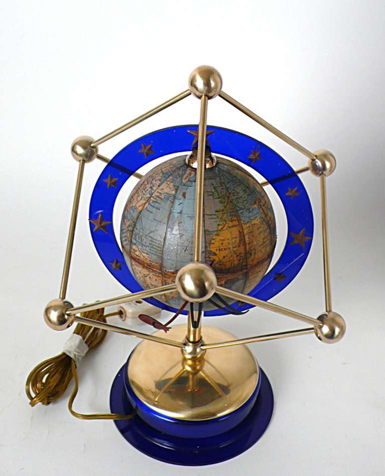 An unusual clock globe. Eerste Nederlandsche Industrie Zwolle Holland Model E10 with trade mark TL GLOBE. A 8 inches diameter globe made up of twelve printed and coloured paper gores ( paper lifting the equator, some minor restorations), the