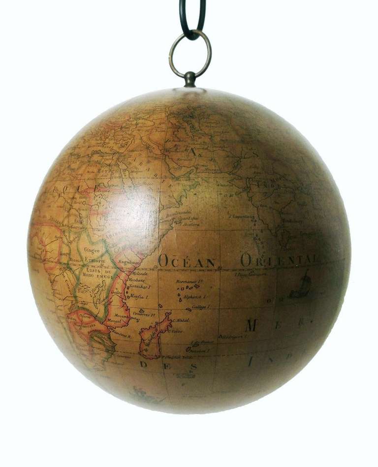 This extremely rare terrestrial swinging globe is an exceptional find.
Designed, created and built to be hanged to the ceiling in order to spin and play with it. Rare are the cases of pre-revolutionary French globes, and most of all the swinging