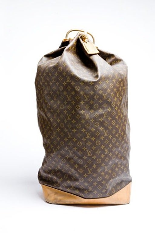 Louis Vuitton big sailor traveling bag with lether handle and brass handle.