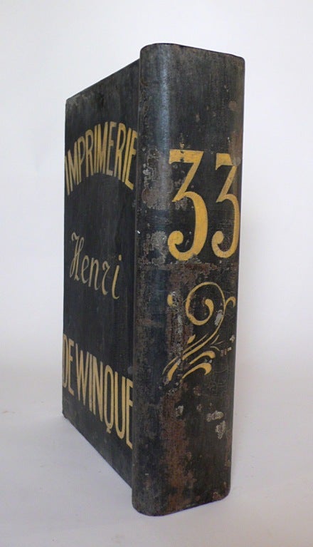 A Painted Tin Tipography Trade Sign Depicting A Book. 1