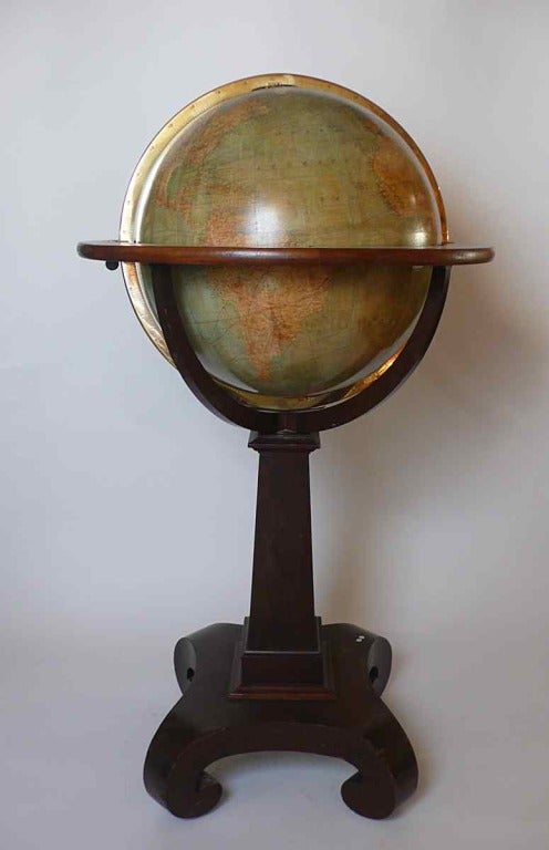 Exceptional 18 inches English library terrestrial globe, wooden and printed paper horizon circle, over a wooden stand with metal wheels. Extremely rich cartography, including the submarine telegraph cables, Main Isothermal lines for January and July