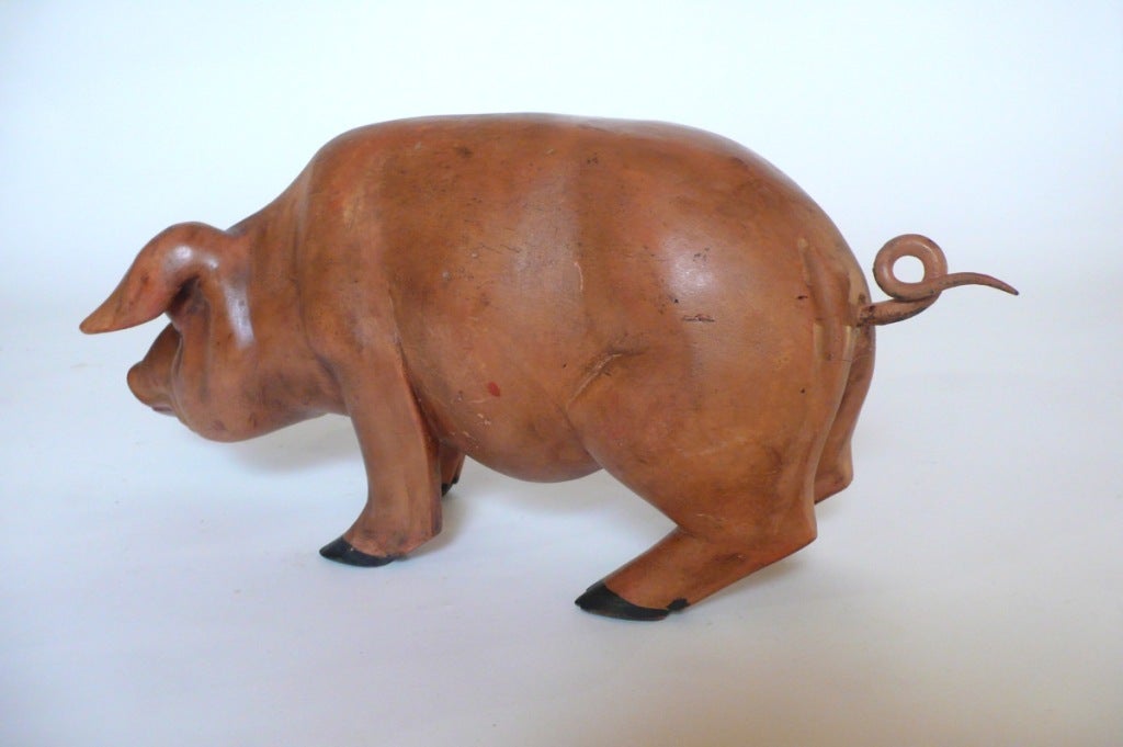 American A Carved Wooden Sculpture Depicting A Pig.