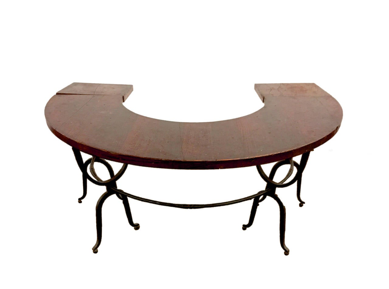 This unusual hunt table has cast iron arch shaped refined leg in an intrigued pattern and semi circle shaped table. Used for wine testing.
It has two extensions , one each side. United States, 1900 ca.