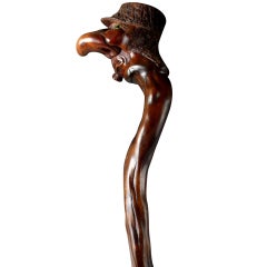 A Carved And Stained Wood Walking Stick.