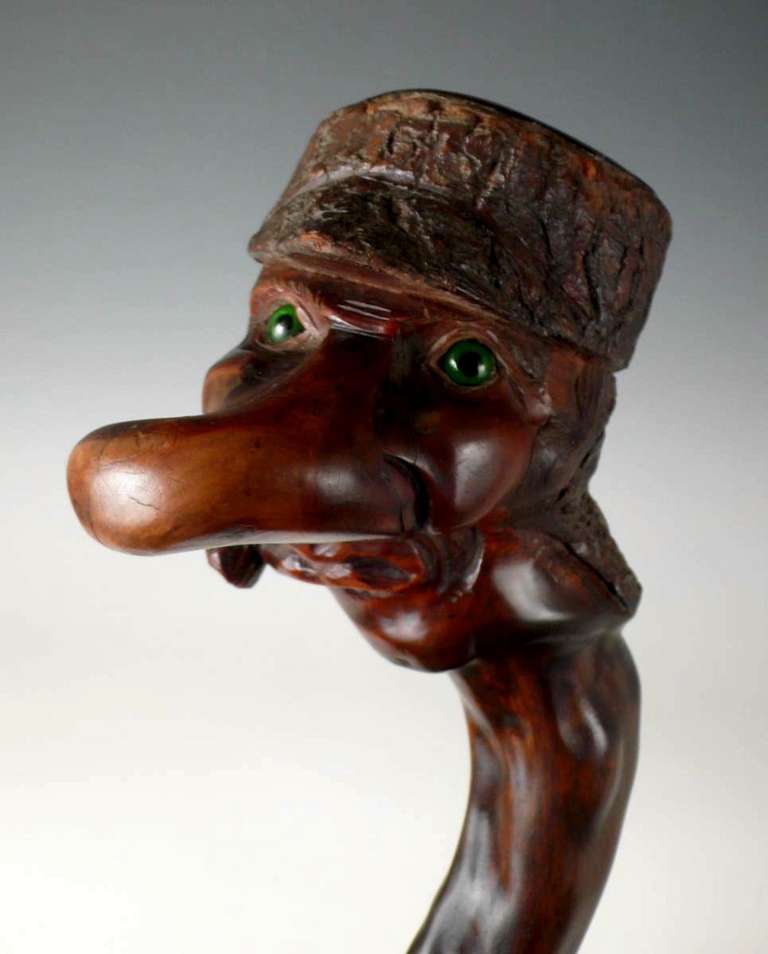 A Carved And Stained Wood Walking Stick. 1